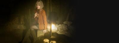 Resident Evil 4 — blonde woman in an orange jacket sits on a stone bench in a dim, candlelit room, holding a small glowing light with shadows cast on the walls.