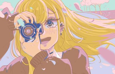 My Dress-Up Darling character smiling and blushing while holding a camera to her eye, long blonde hair flowing in the breeze, pastel sky and pink cherry blossom petals drifting around her.