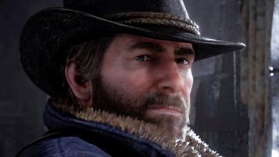 Close-up of Arthur Morgan from Red Dead Redemption 2, a bearded cowboy in a hat and fur-collared coat, looking stoic in a dim, snowy interior.