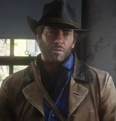 Arthur Morgan from Red Dead Redemption 2 stands indoors wearing a black cowboy hat, worn brown duster and blue shirt, his face shadowed by the brim with window light behind him.