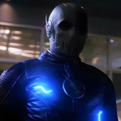 A mysterious character, Zoom from The Flash, stands in a darkened setting, wearing a sleek, black suit illuminated by blue lightning effects and a distinctive mask, exuding an ominous aura.