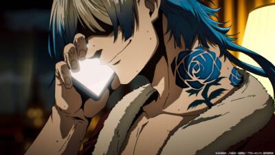 Miachael Kaiser from Blue Lock smirks into a glowing phone, showing teal hair, a blue rose neck tattoo and a fur-collared jacket in warm lamp light.